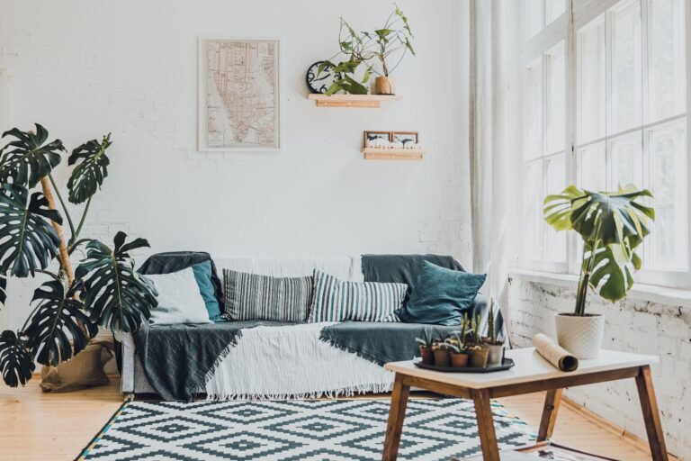Bright living room with healthy indoor plants by a large window